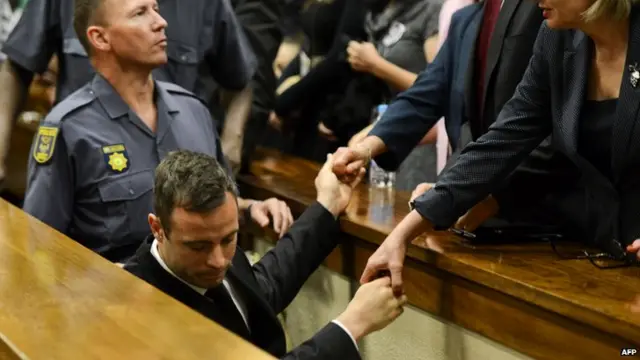 Oscar Pistorius leaving court