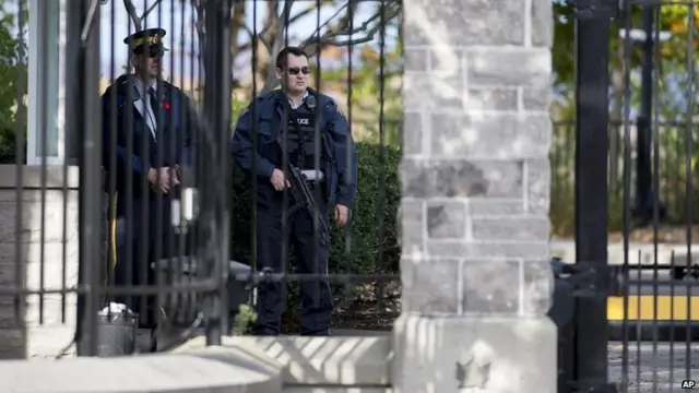 Armed police guard residence of Canada's Prime Minister Stephen Harper. 22 Oct 2014