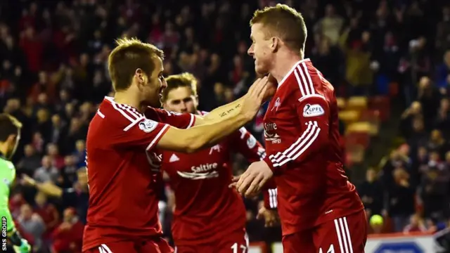 Aberdeen celebrate the early goal from Jonny Hayes (right)