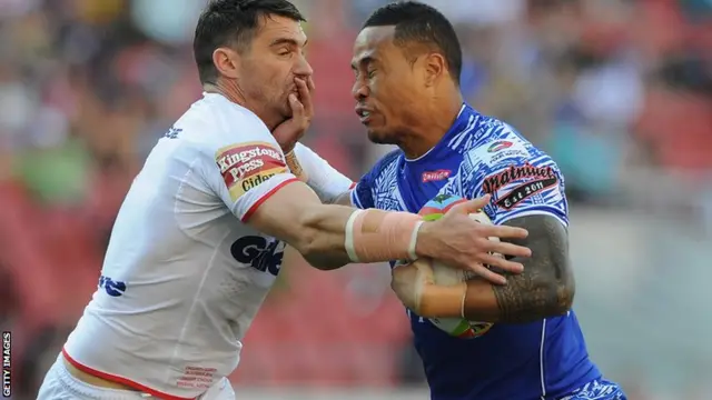 Tim Simona of Samoa is tackled by Matty Smith of England