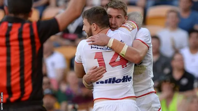 Michael Shenton of England celebrates with Daryl Clark