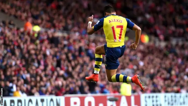 Alexis Sanchez celebrates his goal against Sunderland