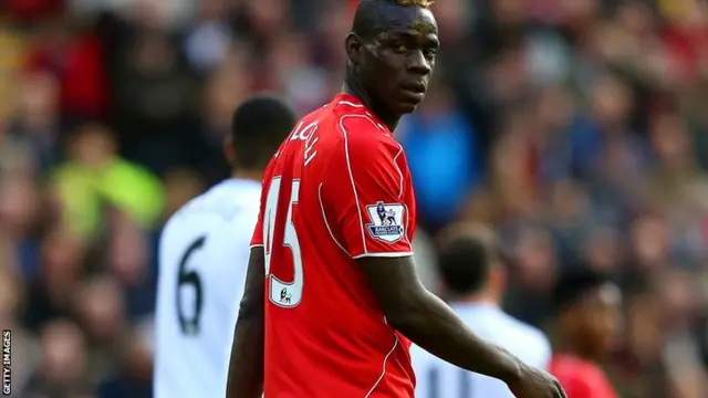 Liverpool striker Mario Balotelli walks off at half-time