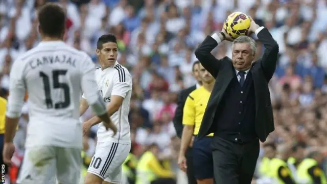 Carlo Ancelotti throws ball