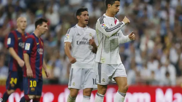 Cristiano Ronaldo gestures to his teammates