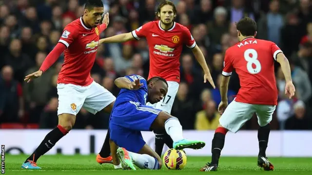 Didier Drogba battles with Chris Smalling