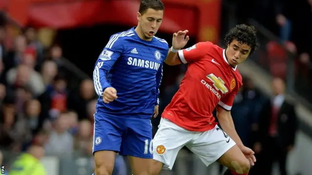 Eden Hazard battles for the ball against Rafael