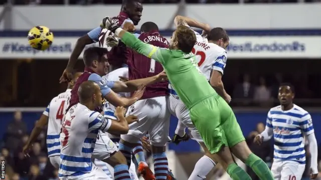 Rob Green punches ball