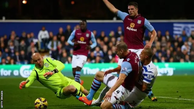 Ron Vlaar tackles Bobby Zamora