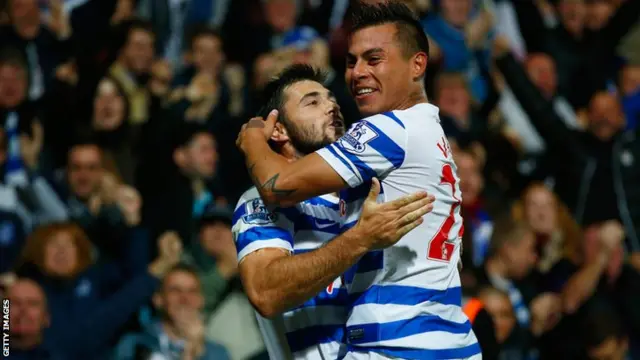 Eduardo Vargas and Charlie Austin celebrate for QPR