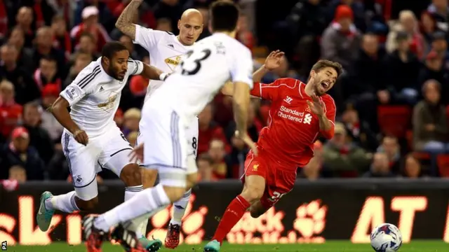 Liverpool striker Fabio Borini goes down