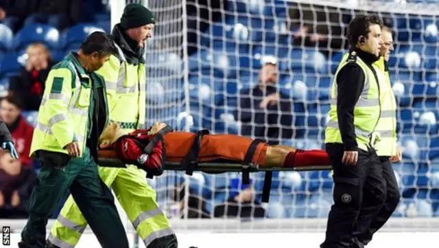 St Johnstone midfielder Murray Davidson is stretchered off after suffering a head knock.