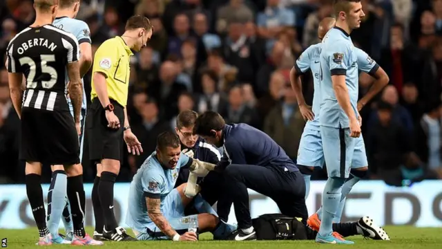 Aleksandar Kolarov is treated for an injury