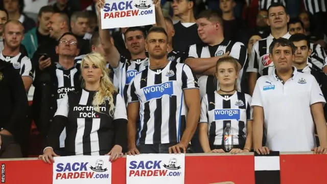 Newcastle fans hold Sack Pardew posters