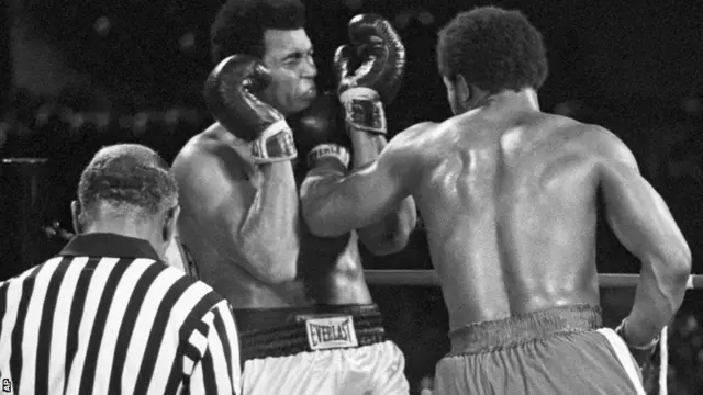 George Foreman lands a jab on Muhammad Ali