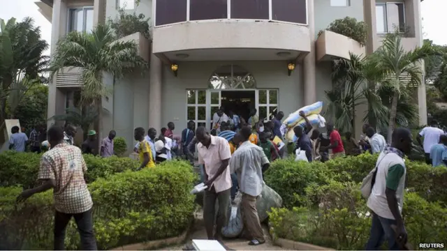 People loot the house belonging to Francois, younger brother of Burkina Faso"s ex-President Blaise Compaore, in Ouagadougou, capital of Burkina Faso, October 31, 2014