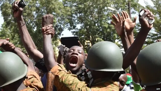 A crowd gathers in front of army headquarters in Ouagadougou, Burkina Faso, 31 October 2014