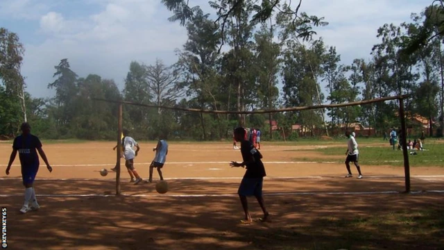 A football pitch in Rwanda, with goals fashioned from wood