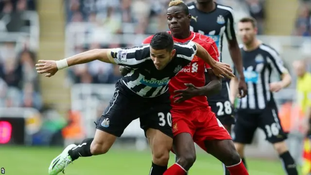 Newcastle's Mehdi Abeid fights for the ball with Mario Balotelli