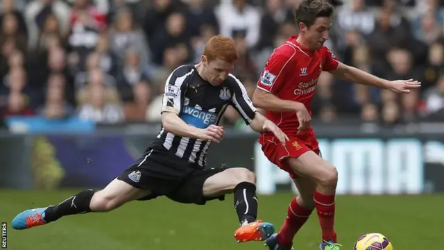 Jack Colback and Joe Allen vie for the ball