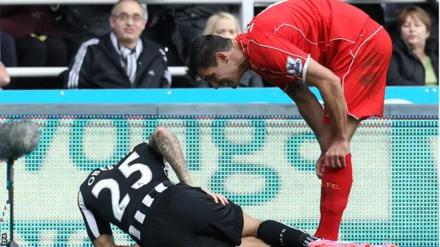 Newcastle winger Gabriel Obertan lies on the ground with an injury