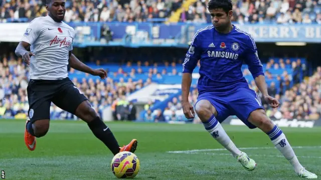 Chelsea's Diego Costa takes on QPR's Junior Hoilett