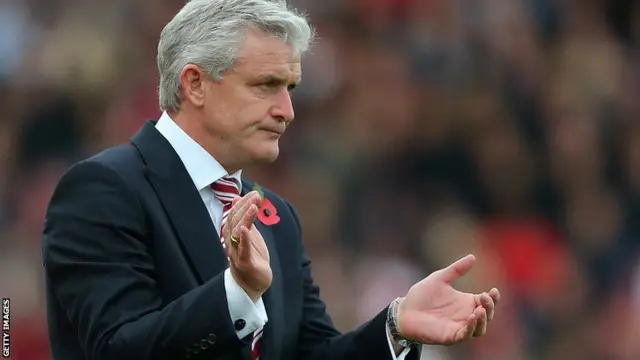 Stoke manager Mark Hughes celebrates