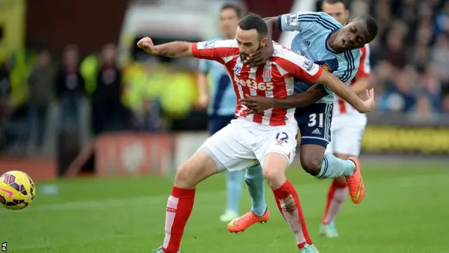 Stoke's Marc Wilson and West Ham striker Enner Valencia tussle