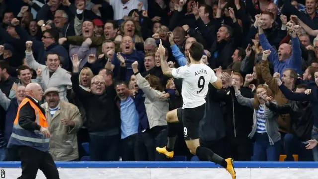 Charlie Austin celebrates with QPR fans