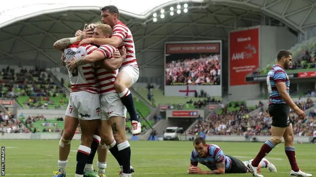 Kallum Watkins scores a try for England