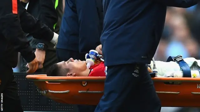 Manchester United defender Marcos Rojo is stretchered off