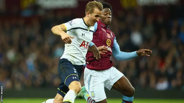 Harry Kane is challenged by Carlos Sanchez