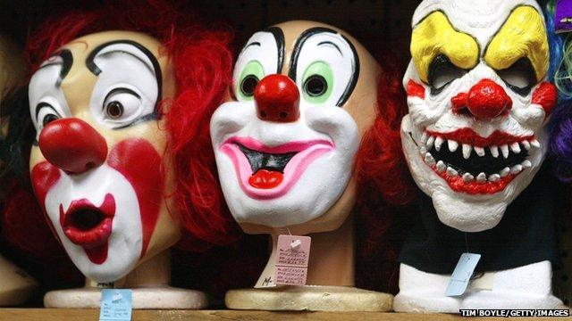 Clown masks displayed at a costume store