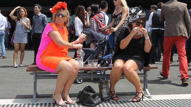 Women eating sandwiches at Randwick Racecourse