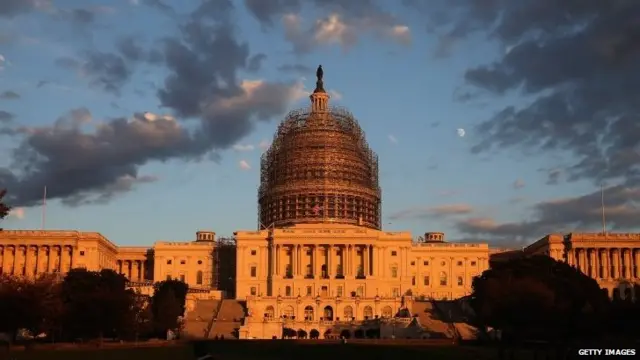 The afternoon sun hits the US Capitol on the eve of the nation's mid-term elections, 3 November 2014, in Washington, DC