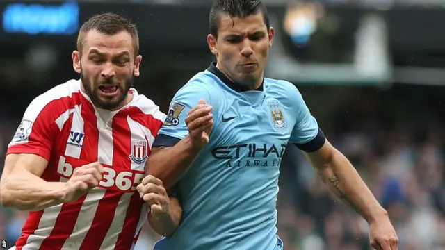 Phil Bardsley (left) tackles Sergio Aguero