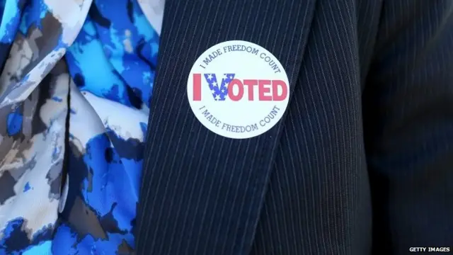 A voter wears an "I Voted" sticker after casting her ballot at The Coliseum where a polling station is setup in St Petersburg, United States, 4 November 2014