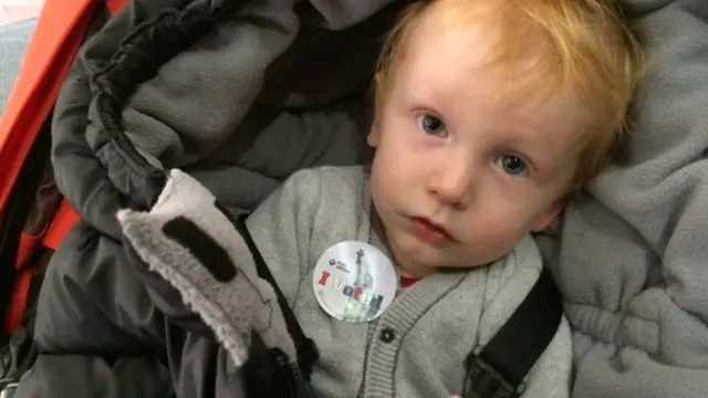 A toddler wears a sticker that reads "I voted" at a New York City Polling site, 4 November 2014