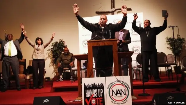 Community activist Anthony Shaheed (centre) inspires residents of Ferguson, Missouri and surrounding communities at a get out the vote rally at Greatest St. Mark's Family Church in St Louis, Missouri, 3 November 2014