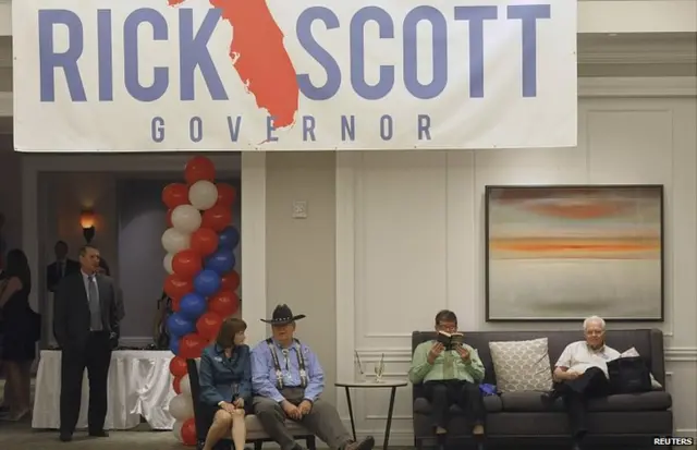 Supporters of Republican Florida Governor Rick Scott wait for start of a mid-term elections night party in Bonita Springs, Florida,