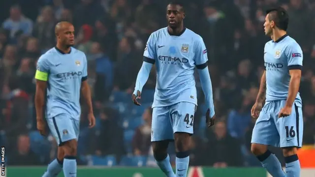 Manchester City players look on dejected