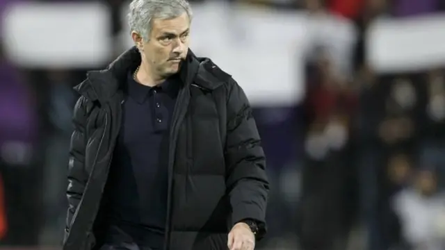 Jose Mourinho walks down the touchline