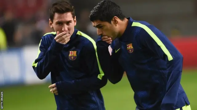 Lionel Messi and Luis Suarez whispering