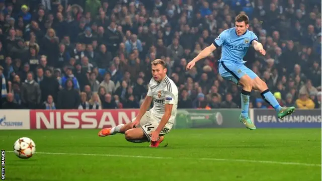 James Milner shoots at goal