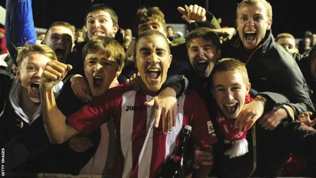 Brackley celebrate their FA Cup win against Gillingham