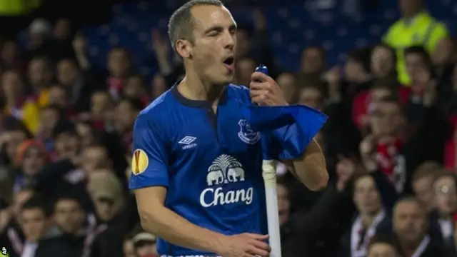 Leon Osman celebrates with the corner flag