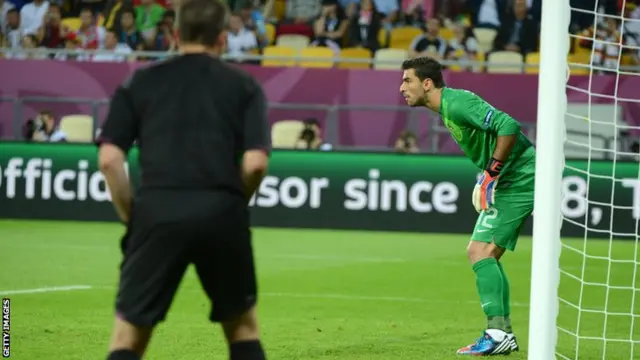 A fifth offivial watches the goal line