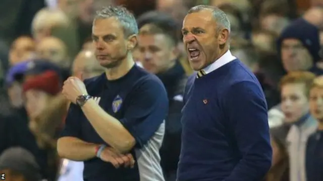 Shaun Reid shouts instructions from the touchline