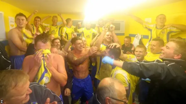 Warrington player celebrate in the changing rooms