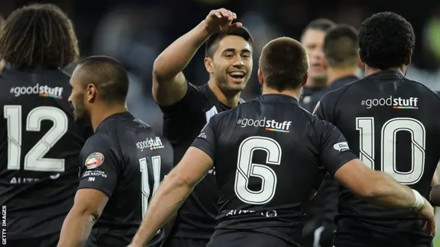 New Zealand celebrate their second try against England